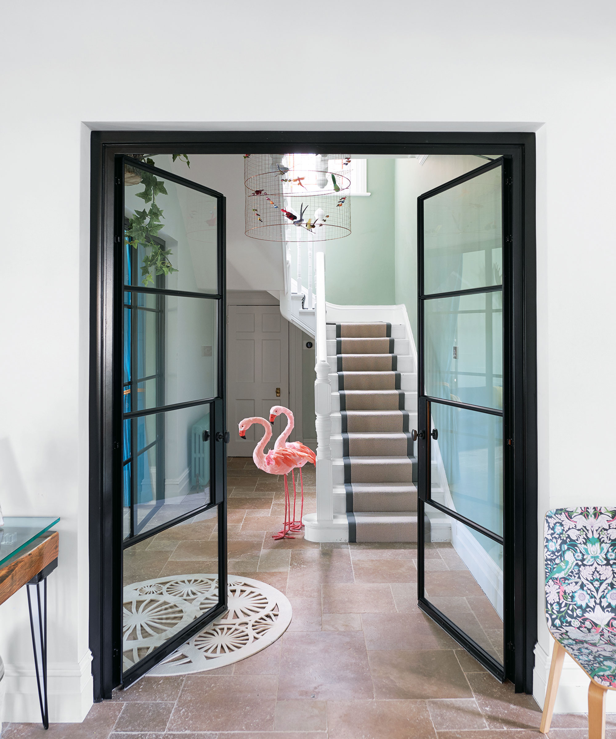 Hallway with white and grey color scheme and stone floor