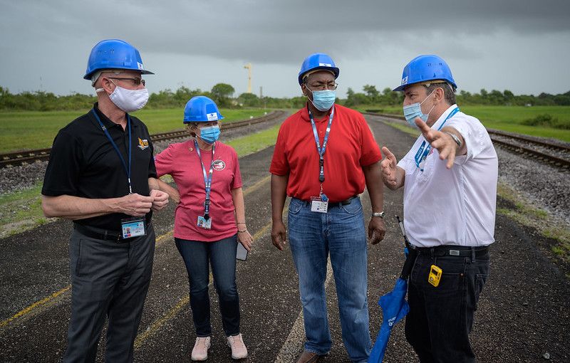 Leaders on the James Webb Space Telescope launch confer as the rocket rolls out to the launch pad. From left, NASA James Webb Space Telescope Program Scientist Eric James, NASA James Webb Space Telescope Program Manager Jeanne Davis, NASA Program Director for the James Webb Space Telescope Greg Robinson, and Arianespace&rsquo;s Vice President for French Guiana Bruno G&eacute;rard.