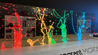 The transparent Samsung Micro LED at CES 2024, depicting colorful paint splashes