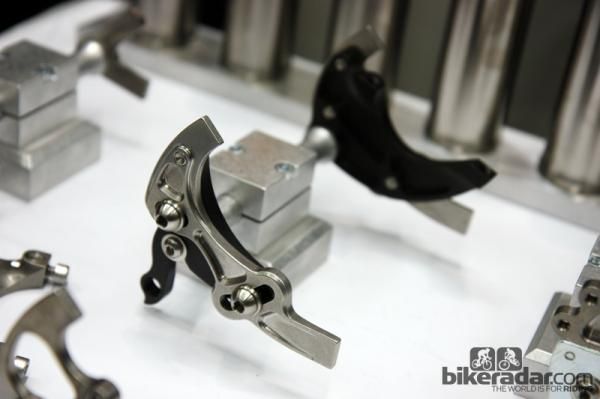 These Paragon Machine Works pivoting dropouts aren't entirely new but the post mount disc caliper tabs are, though.