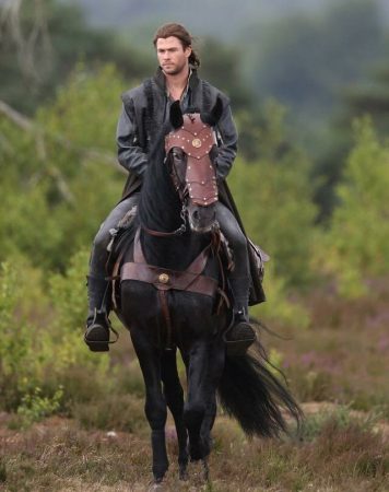Pinocchio being ridden by Chris Hemsworth