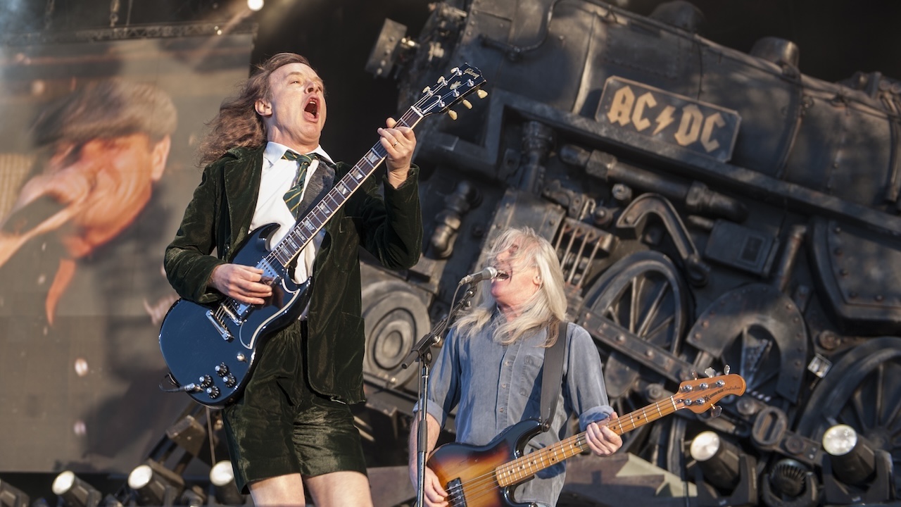 Angus Young and Cliff Williams of AC/DC perform at Download on June 11, 2011 in Castle Donington, England. 