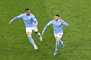 Foden (right) scored in both legs of City's triumph over Dortmund