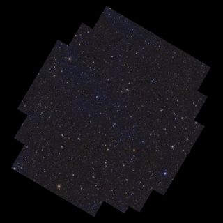 On a black background lies a rectangular shape with several stepped notches cut out of its corners, oriented with its longest edges running from bottom left to top right. Contained within the shape are more than ten million galaxies, and stars of various size, brightness and colour. Wispy, faint blue cloud-like structures permeate the image, representing gas and dust in between the stars in our own galaxy