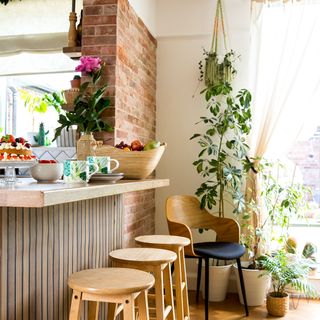 kitchen diner with island and wooden bar stools
