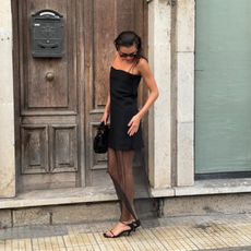 Valeria in a black dress with a sheer skirt