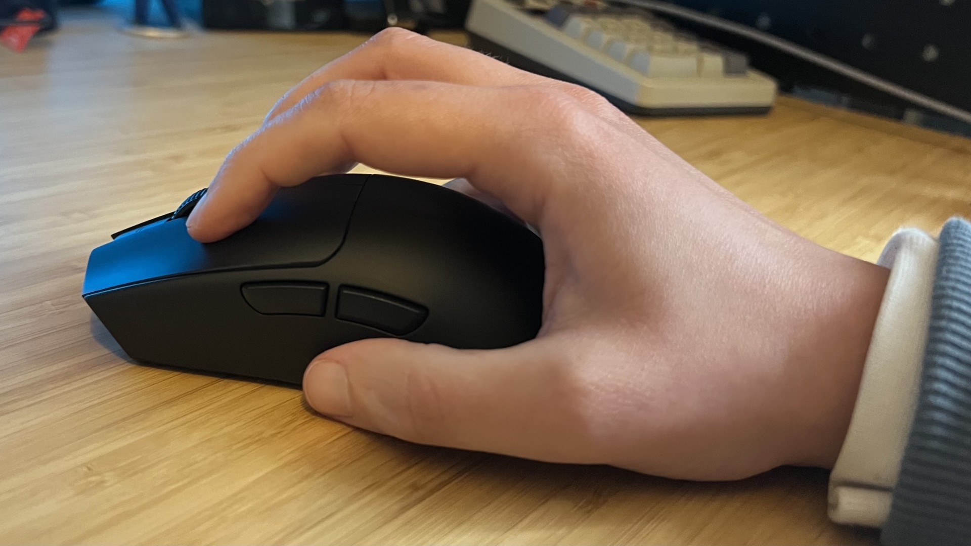 Hand using the Razer Viper V4 Pro gaming mouse in a claw grip