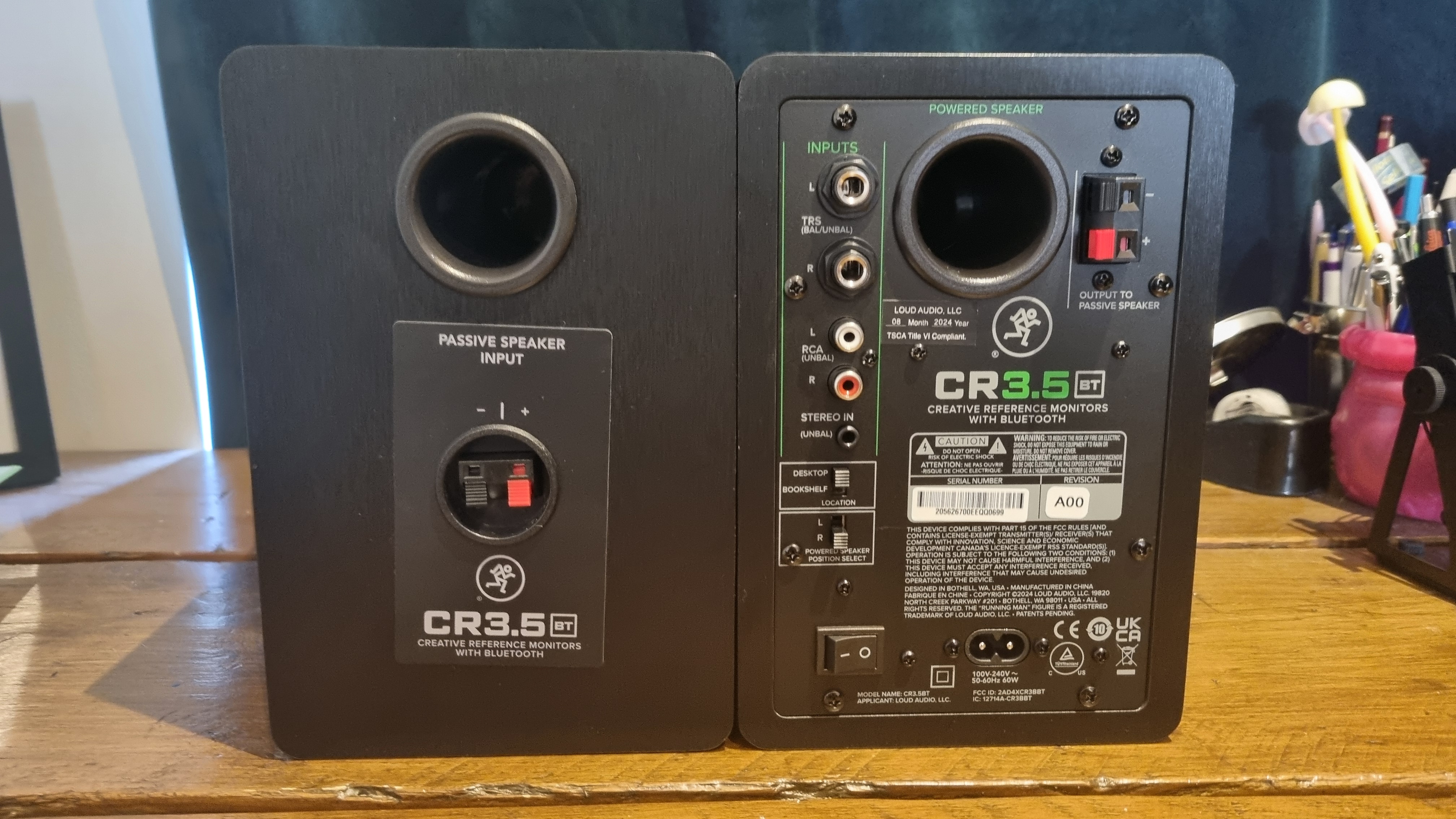 The rear of the Mackie CR3.5 desktop speakers, showing the various connections and the rear bass ports