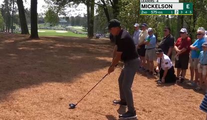 Phil Mickelson sets up with a driver off the pine straw at Augusta National