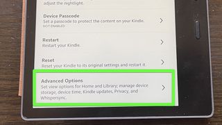 A Kindle Oasis with "Advanced Options" highlighted