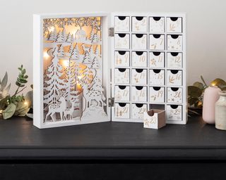 A wooden white fold-out LED Christmas Advent Calendar