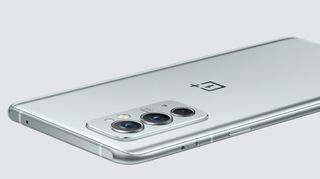 A silver OnePlus 9RT from the back