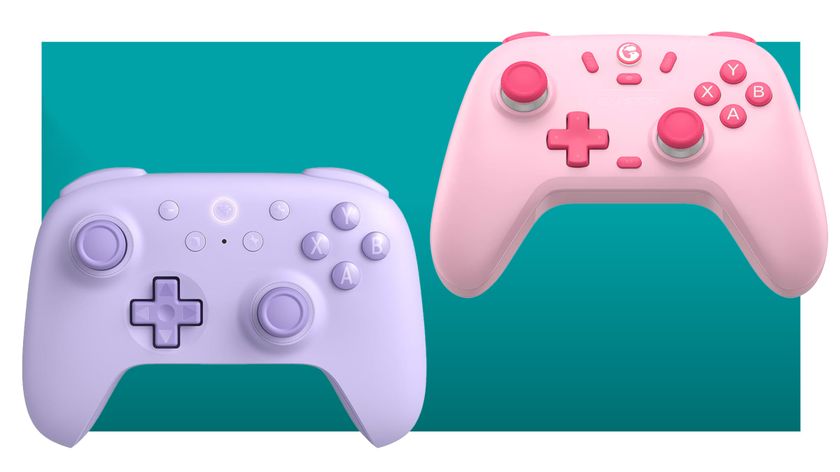 A pink GameSir Nova Lite, and a purple 8BitDo Ultimate 2C float in a teal void.