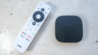 The Onn Android TV UHD box and remote side by side