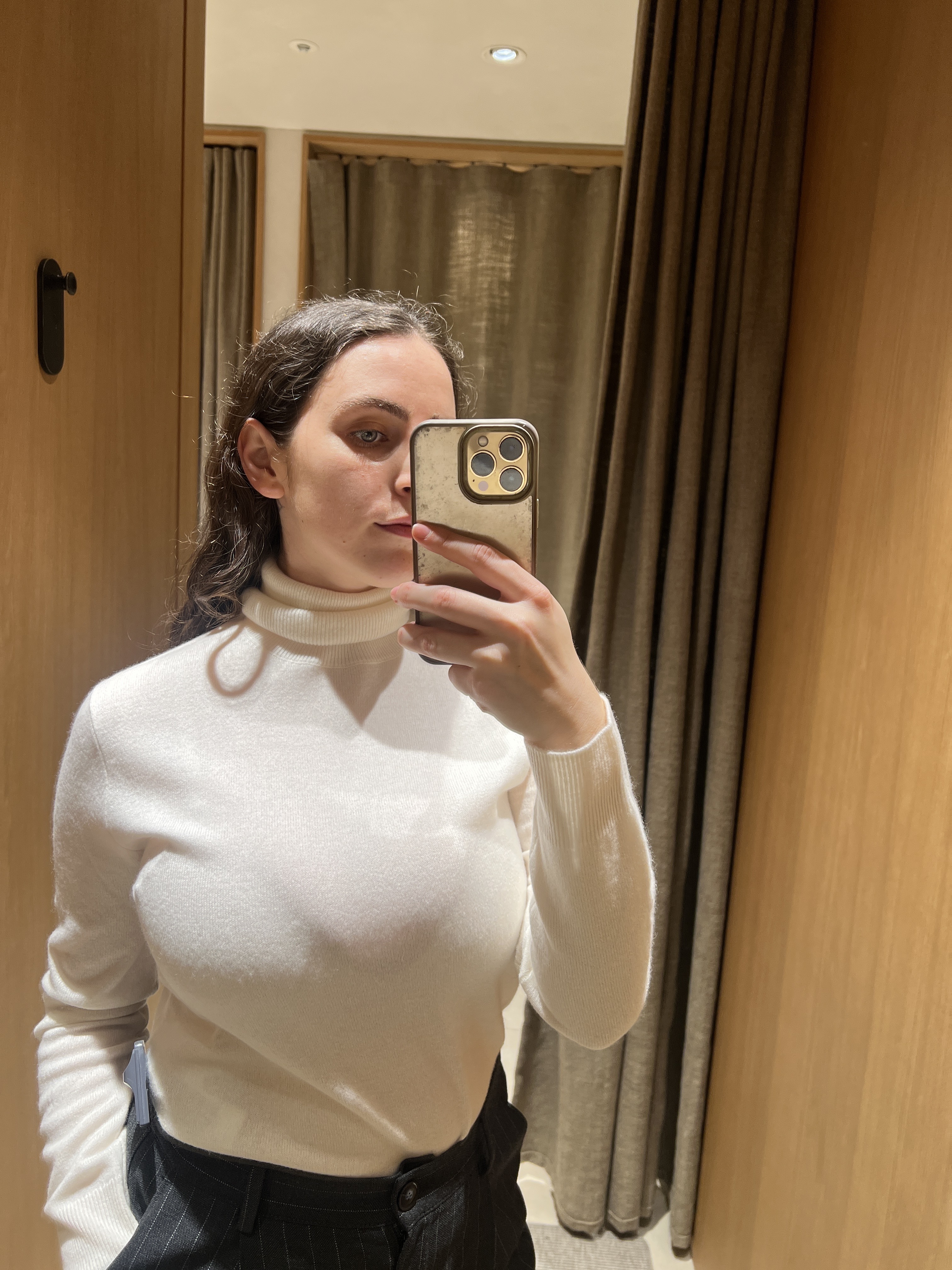 An image of Who What Wear&#039;s Ava Gilchrist wearing one of the best turtlenecks from Massimo Dutti.