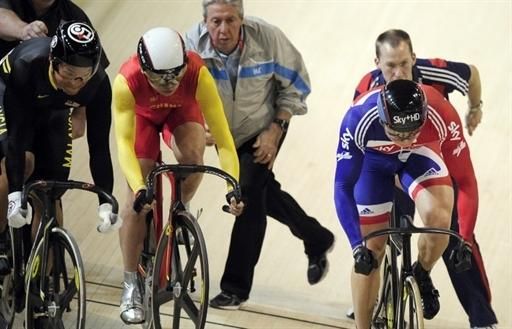 The men's keirin round 1 heat is re-started after the crash of Hoy.