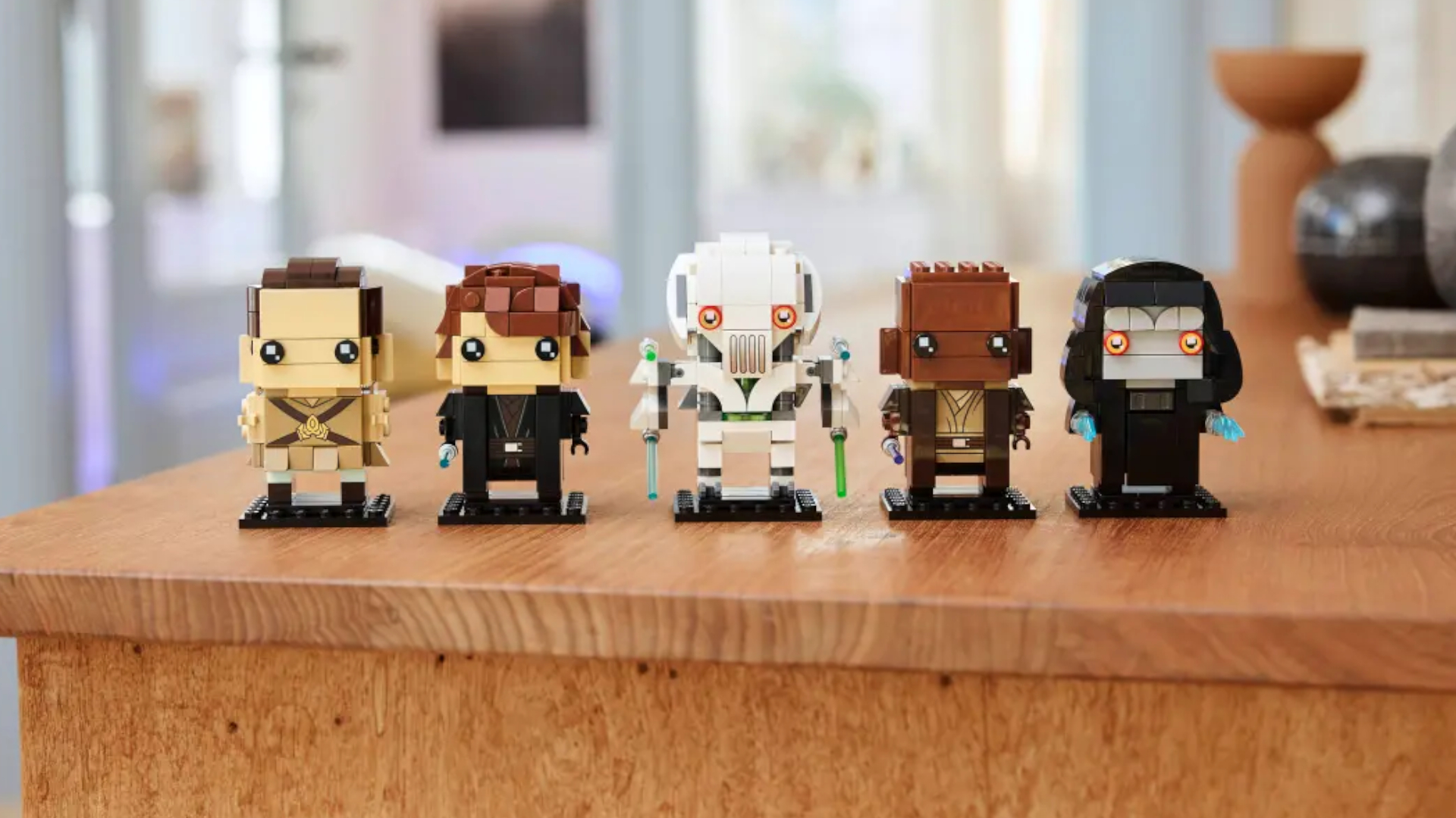 Lego Revenge of the Sith BrickHeadz lined up on a wooden table