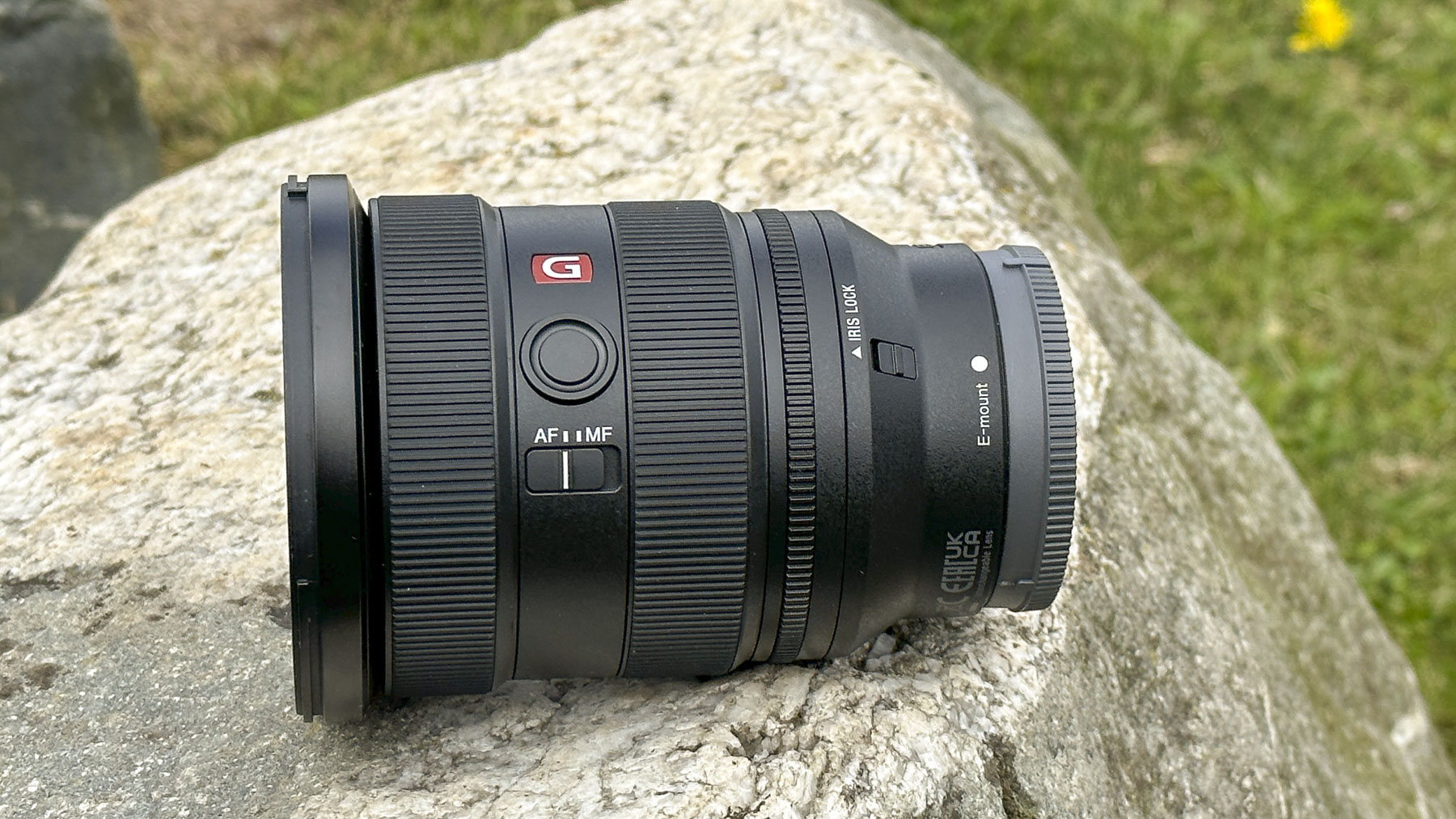 Sony FE 16-35mm F2.8 GM II lens outdoors on a rock