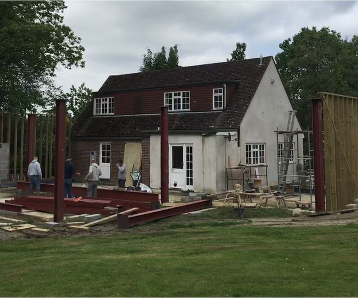 pic of an old pitched roof two-storey house before a renovation