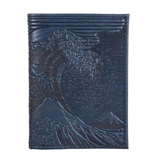 A blue leather passport case embossed with Hokusai's The Great Wave