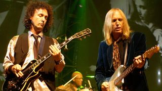 Mike Campbell (left) and Tom Petty perform at the Forum in Los Angeles, 2002.