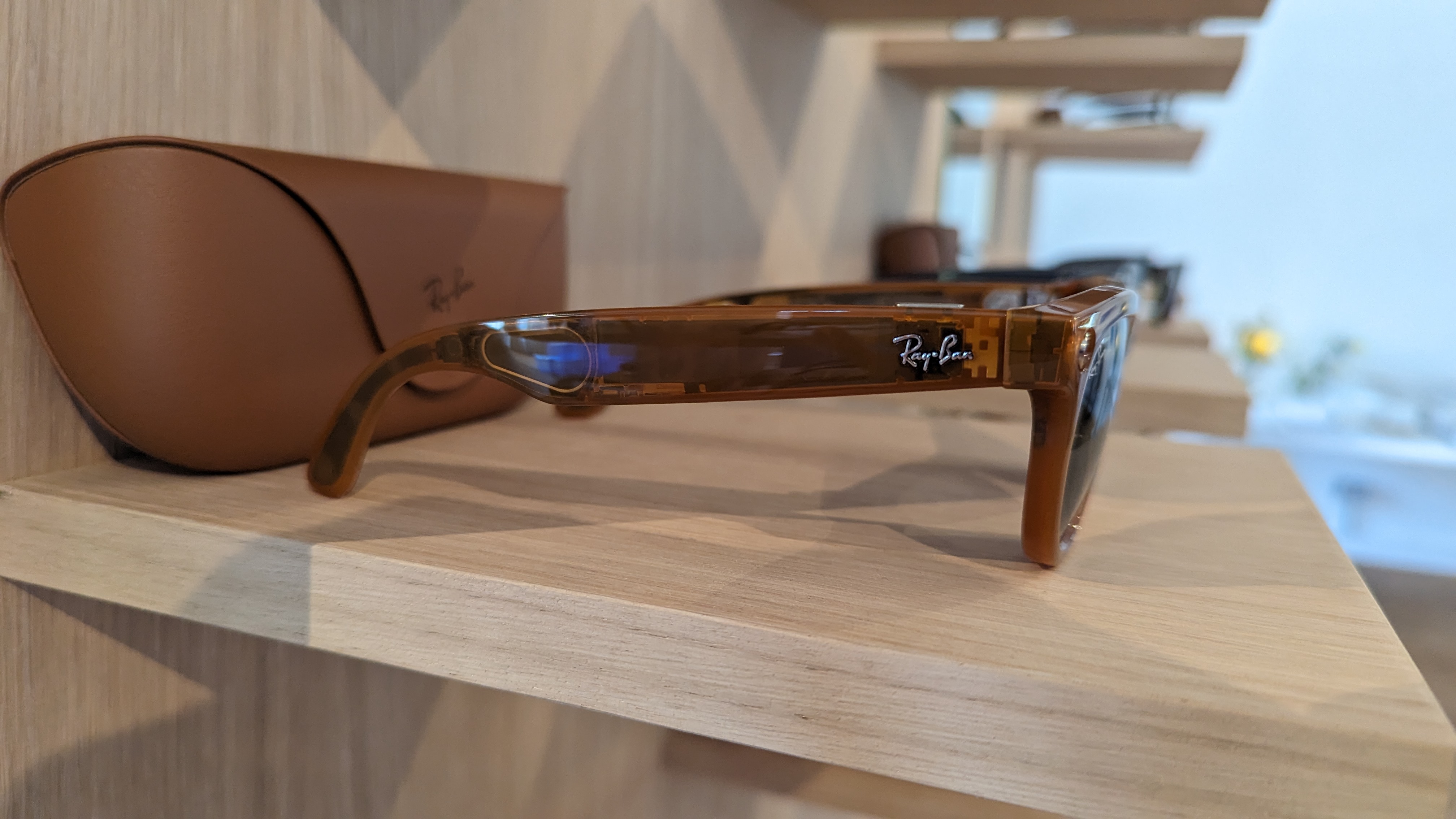 You can see inside these transparent orange frames, giving you a look at the internal componenst and spoeakers housed in the arm of the Ray-Ban and Meta smart glasses