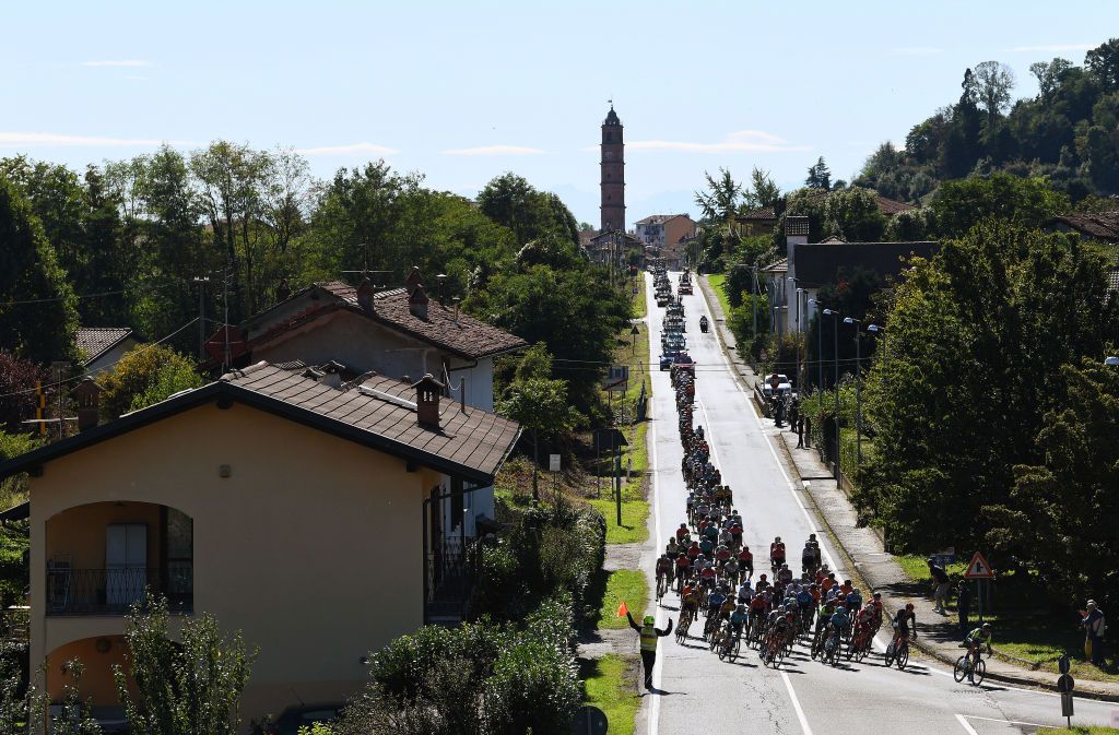 BORGOSESIA ITALY OCTOBER 07 A general view of the Peloton passing through during the 105th Gran Piemonte 2021 a 168km race from Rocca Canavese to Borgosesia 350m GranPiemonte on October 07 2021 in Borgosesia Italy Photo by Tim de WaeleGetty Images