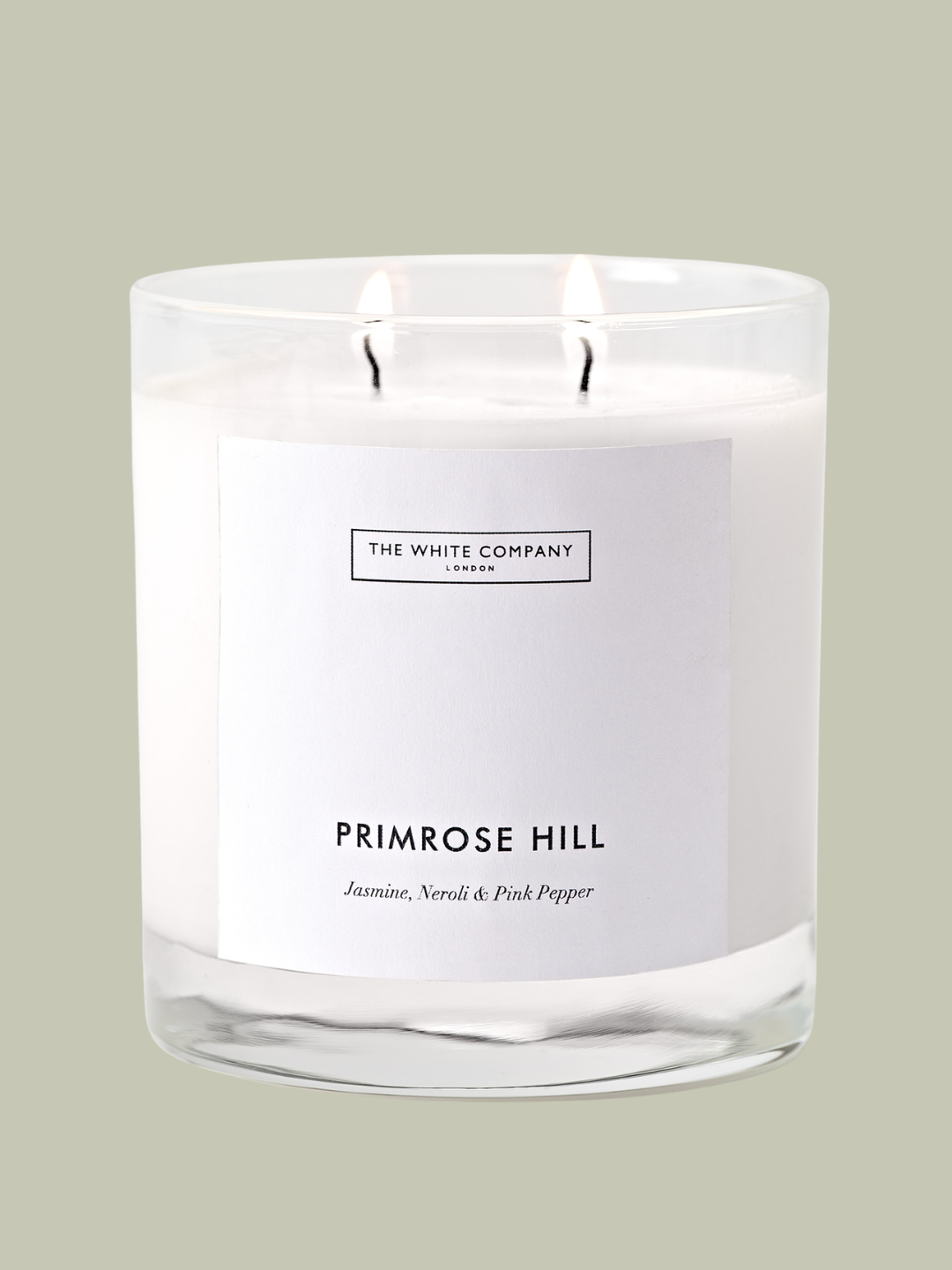 A white candle in a glass vessel from The White Company