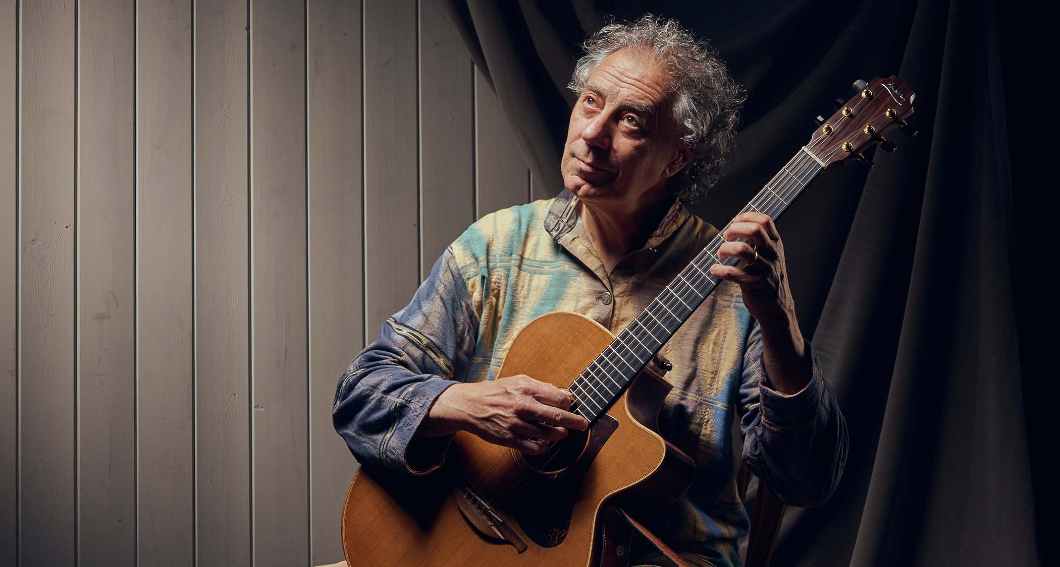 Pierre Bensusan is photographed with his beloved Lowden acoustic