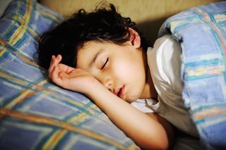 Sleeping boy in bed