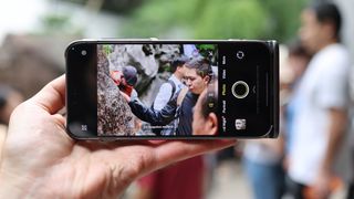 Vivo X300 Pro camera phone held in a hand