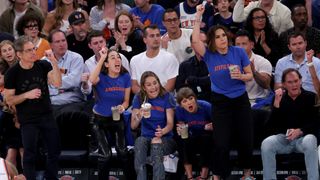 (L to R) Ben Stiller, Alana Haim, Este Haim, Taylor Swift, and Mariska Hargitay attend Game Four of the 2026 NBA Finals. The Haims, Swift and Hargitay are wearing matching shirts. 