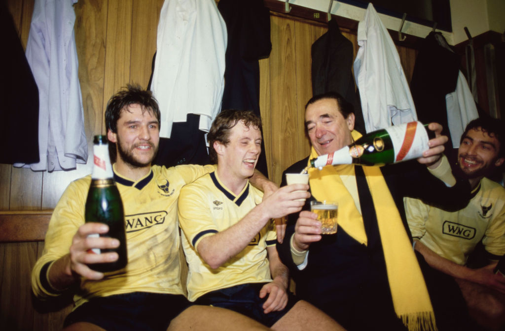 Oxford United chairman Robert Maxwell celebrates with the players after winning the 1986 Milk Cup
