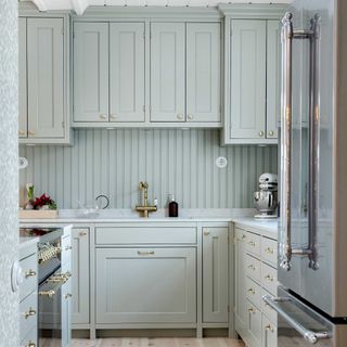 pale blue kitchen with wall panelling