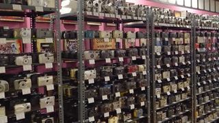 A photograph of hundreds of compact cameras on shelves, captured within Dr Arun’s Camera Museum