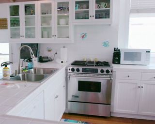 kitchen with wooden floor and white interior