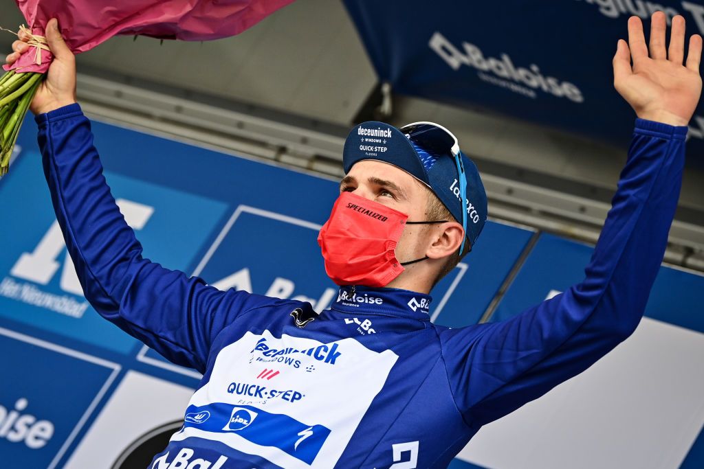 Belgian Remco Evenepoel of Deceuninck QuickStep celebrates on the podium in the blue jersey of leader in the overall ranking the fourth stage of the Baloise Belgium Tour cycling race 1526 km from and to Hamoir Saturday 12 June 2021 BELGA PHOTO DAVID STOCKMAN Photo by DAVID STOCKMANBELGA MAGAFP via Getty Images