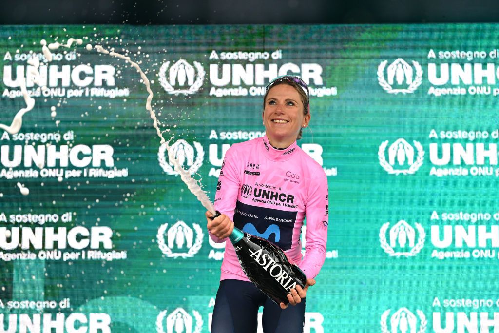 PASSO DEL MANIVA ITALY JULY 07 Annemiek Van Vleuten of Netherlands and Movistar Team celebrates winning the pink leader jersey on the podium ceremony after the 33rd Giro dItalia Donne 2022 Stage 7 a 1129km stage from Prevalle to Passo del Maniva 1743m GiroDonne UCIWWT on July 07 2022 in Passo del Maniva Italy Photo by Dario BelingheriGetty Images