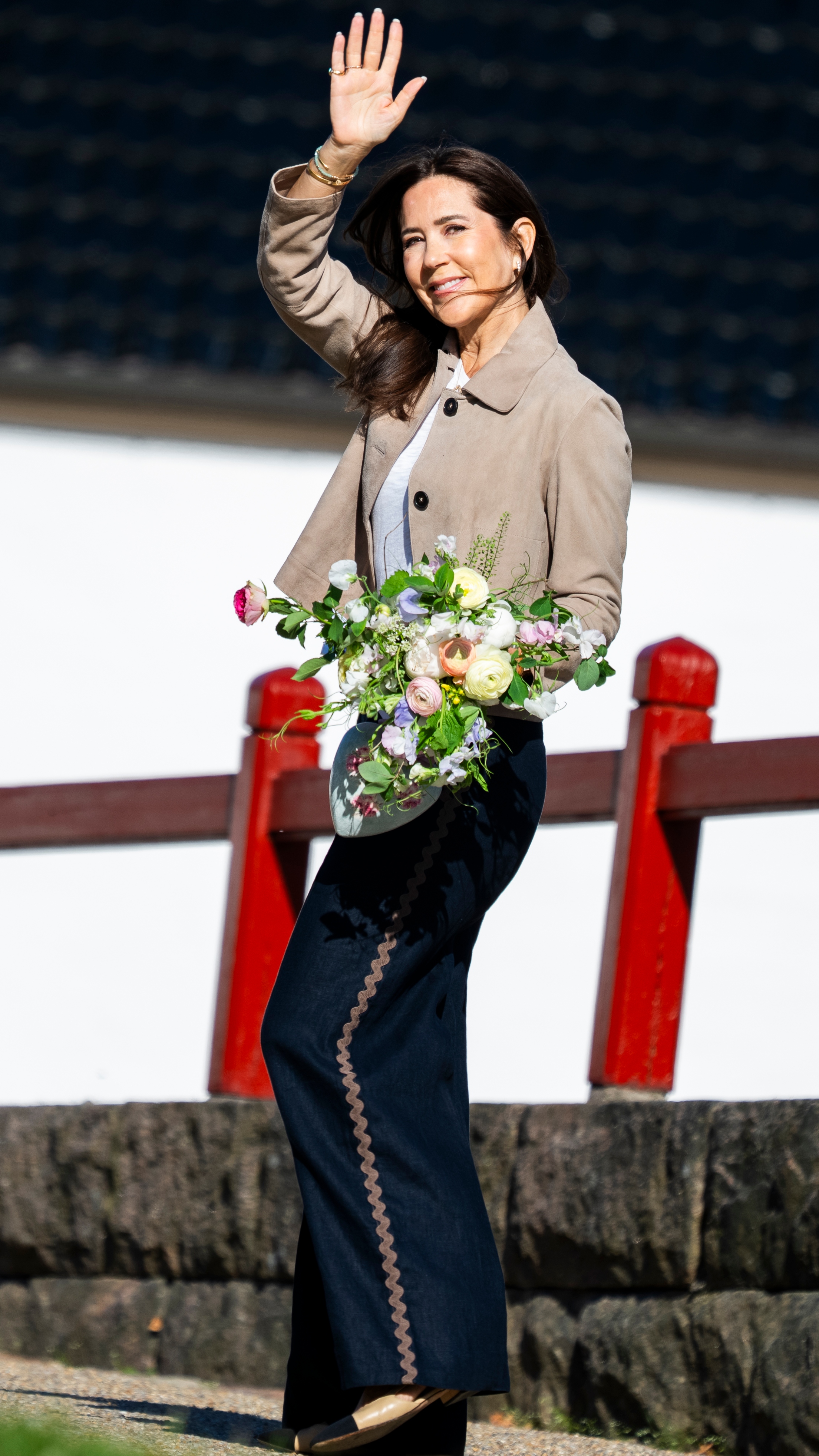 Queen Mary of Denmark waves as she arrives to begin her summer residence at Fredensborg Castle on May 4, 2026