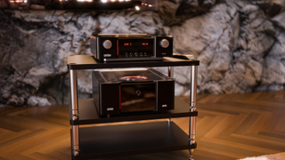 Mark Levinson No. 626 and No. 632 amplifiers on a stand in a living room