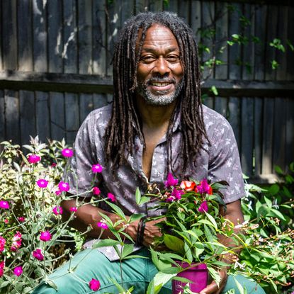 gardener holding flower plants