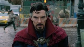 Bendict Cumberbatch stands on a chaotic street in Doctor Strange in the Multiverse of Madness.