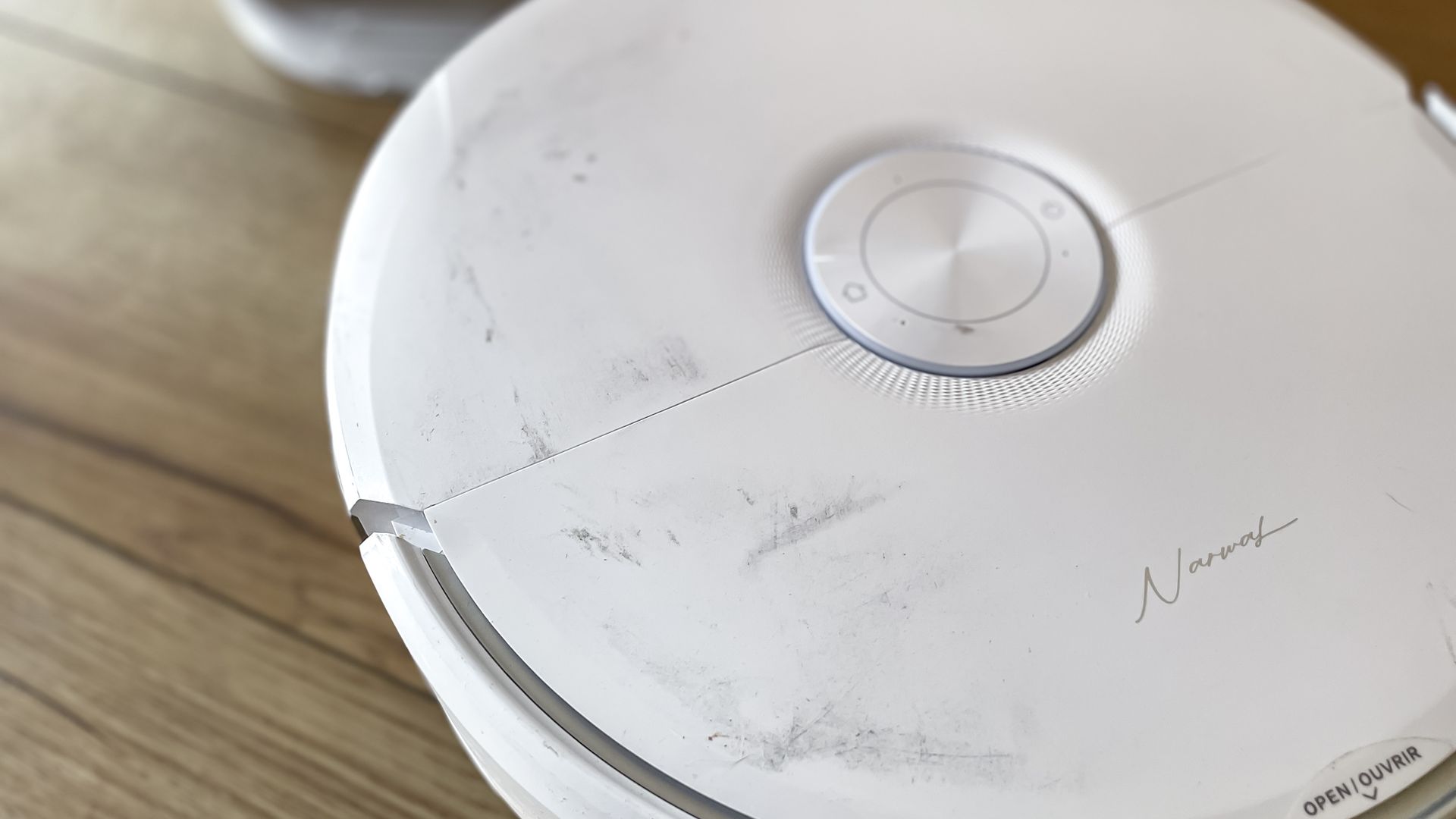 Narwal Freo 20 robot vacuum on a kitchen floor