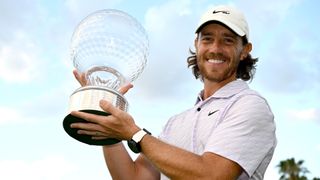 Tommy Fleetwood of England poses with the Nedbank Golf Challenge trophy after winning the Nedbank Golf Challenge in 2022.