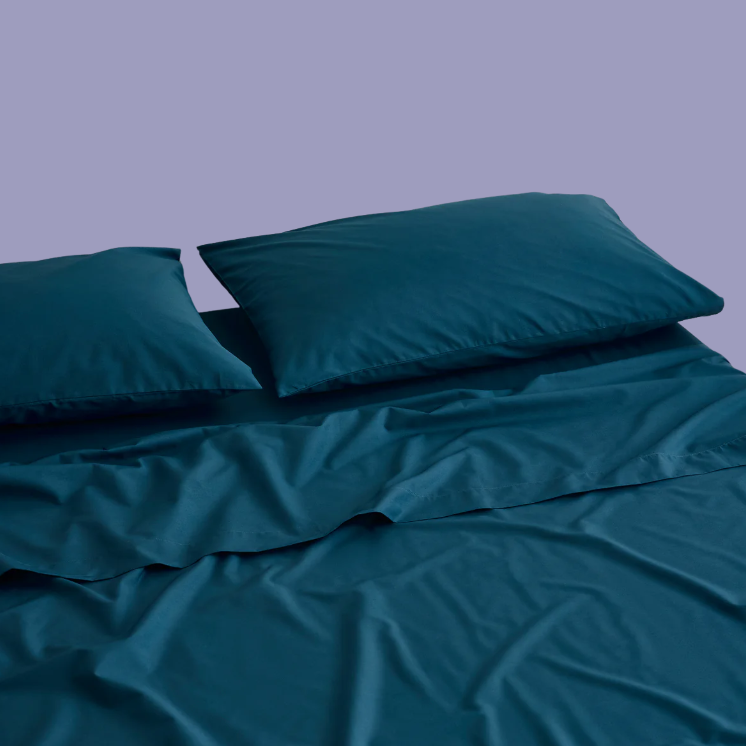 Dark green sheets and pillows