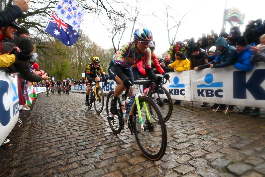 WEVELGEM BELGIUM MARCH 26 LR Anna Henderson of United Kingdom and Team JumboVisma Lotte Kopecky of Belgium and Team SD Worx and Katarzyna Niewiadoma of Poland and Team CanyonSRAM Racing competes passing through a Kemmelberg cobblestones sector during the 12th GentWevelgem In Flanders Fields 2023 Womens Elite a 1625km one day race from Ypres to Wevelgem UCIWWT on March 26 2023 in Wevelgem Belgium Photo by Luc ClaessenGetty Images