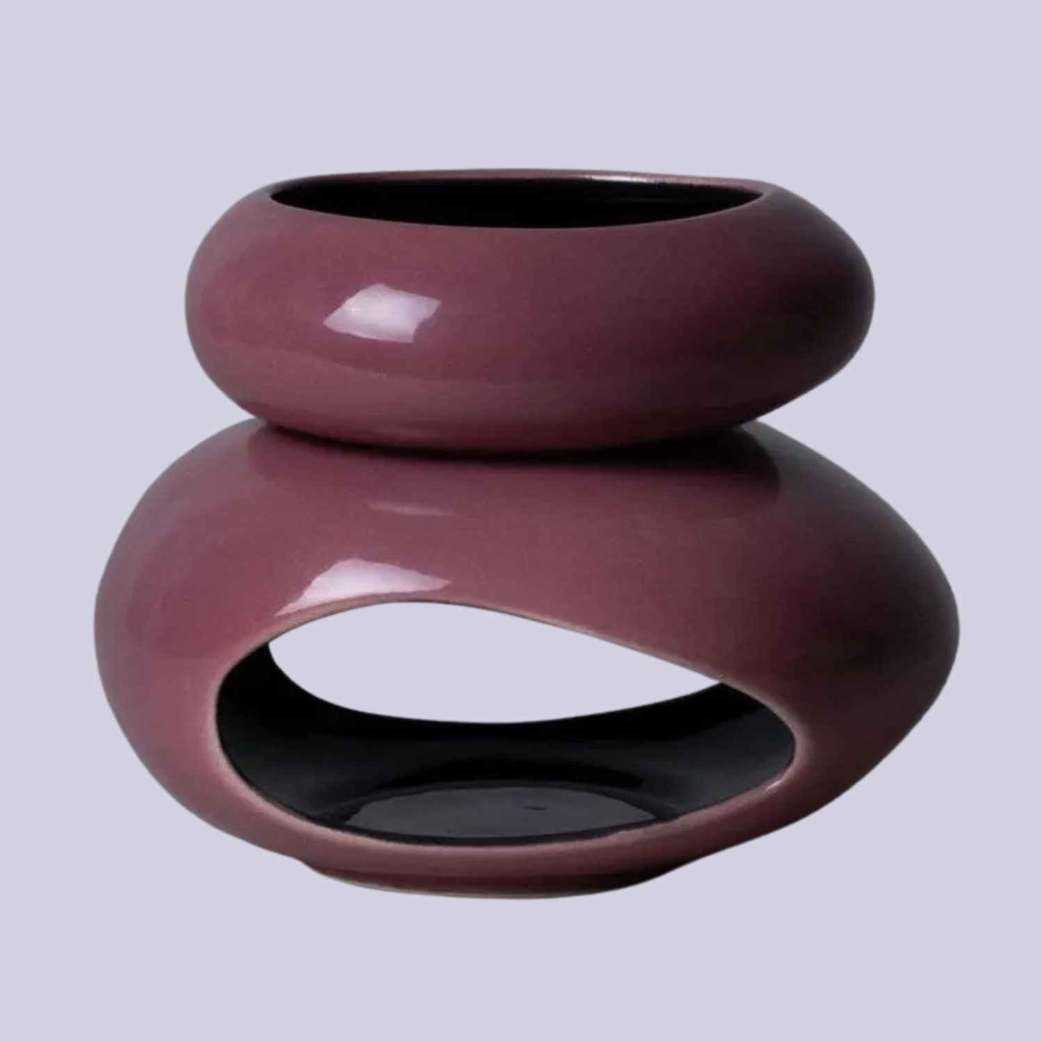 A purple glazed essential oil burner
