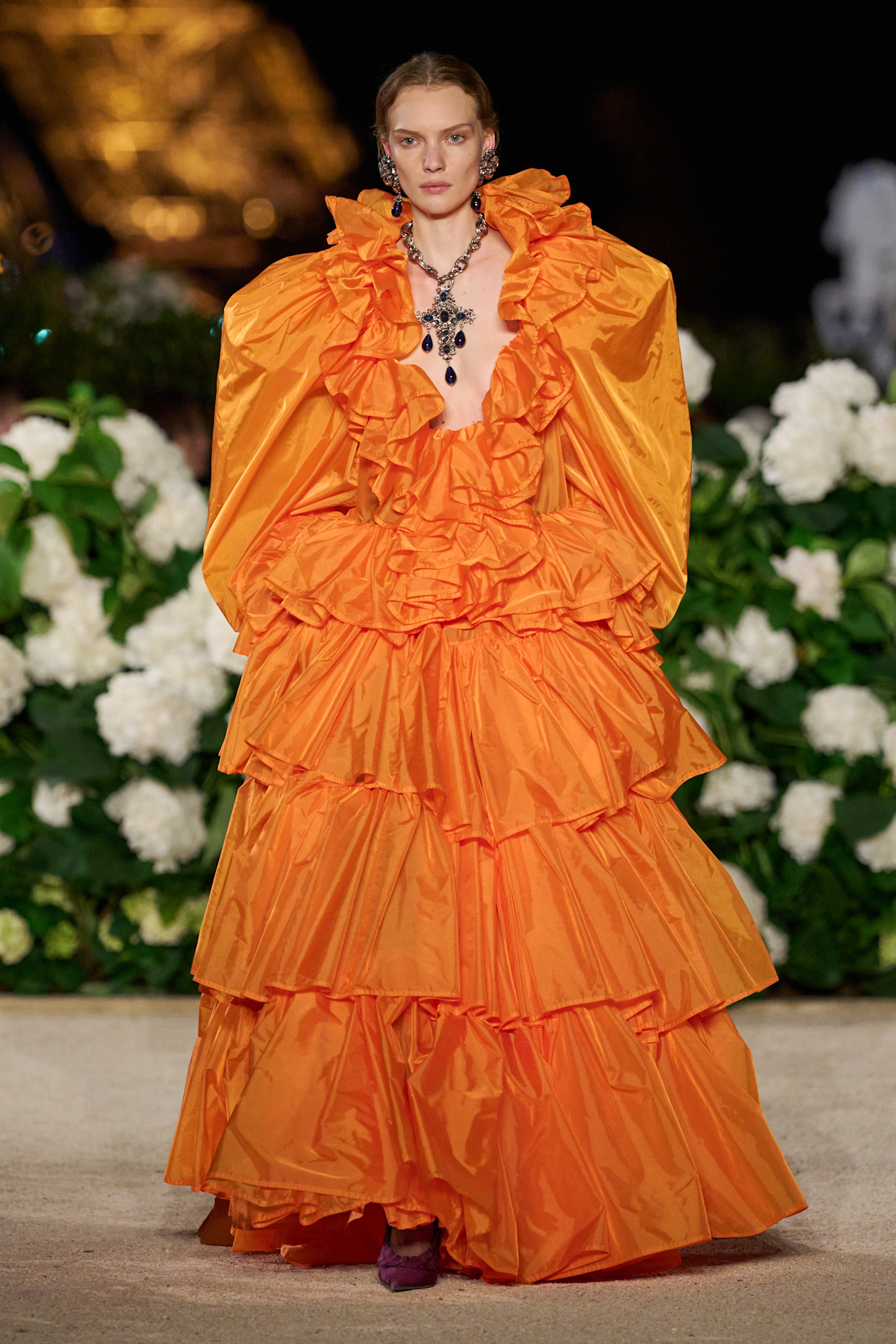 A model wore a bright orange ballgown on Saint Laurent Spring 2026