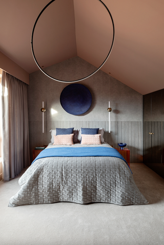 Pink bedroom with pink ceiling and circular light