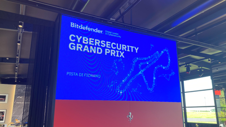 A photo of a screen displaying the Bitdefender Cybersecurity Grand Prix at Pista Di Fiorano in Italy
